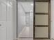 Hallway features light walls and flooring, and a decorative sliding barn door at 710 Treasure Boat Way, Sarasota, FL 34242