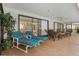 Covered lanai with comfortable lounge seating at 710 Treasure Boat Way, Sarasota, FL 34242