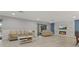 Bright living room featuring comfortable seating, a fireplace, and modern finishes throughout at 710 Treasure Boat Way, Sarasota, FL 34242