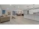 Open floor plan boasts a fireplace, dining area, and a kitchen with stainless steel appliances at 710 Treasure Boat Way, Sarasota, FL 34242