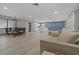 Spacious living area with new wood floors, a combination dining area, kitchen with bar, and living room at 710 Treasure Boat Way, Sarasota, FL 34242