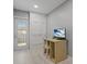 Small office features neutral colors and a door that leads to the exterior at 710 Treasure Boat Way, Sarasota, FL 34242
