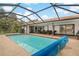 Enclosed pool with covered lanai and outdoor seating at 710 Treasure Boat Way, Sarasota, FL 34242