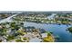 Aerial view of waterfront community, highlighting modern homes with dock access and beautiful bay views at 777 Gran Kaymen Way, Apollo Beach, FL 33572