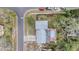 Aerial view of home featuring a pool and fenced yard in a residential neighborhood at 8019 Capwood Ave, Temple Terrace, FL 33637