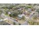 Aerial view shows a home nestled among mature trees in a residential neighborhood at 8019 Capwood Ave, Temple Terrace, FL 33637