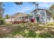 Expansive backyard featuring a large deck and above ground swimming pool at 8019 Capwood Ave, Temple Terrace, FL 33637