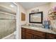 Well-maintained bathroom featuring a granite countertop, vanity, and glass shower enclosure at 8019 Capwood Ave, Temple Terrace, FL 33637
