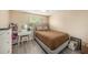 Comfortable bedroom with modern decor, updated flooring, and large window at 8019 Capwood Ave, Temple Terrace, FL 33637