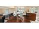 Cozy dining area features a glass table with seating and a breakfast bar, complemented by hardwood floors at 8019 Capwood Ave, Temple Terrace, FL 33637