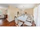 Elegant dining room boasting modern chandelier, stylish furniture, and hardwood floors for sophisticated gatherings at 8019 Capwood Ave, Temple Terrace, FL 33637