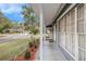 Inviting front porch with manicured landscaping, providing a warm welcome to this charming home at 8019 Capwood Ave, Temple Terrace, FL 33637