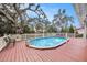 Backyard features a fenced pool and a deck, perfect for entertaining at 8019 Capwood Ave, Temple Terrace, FL 33637