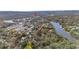 Aerial view shows the home nestled among trees, with waterfront access nearby at 8204 Stoner Rd, Riverview, FL 33569