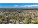 Aerial view of property shows the home's placement on a wooded lot with nearby lake access at 8204 Stoner Rd, Riverview, FL 33569