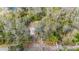 Overhead aerial of property on spacious lot surrounded by mature trees at 8204 Stoner Rd, Riverview, FL 33569