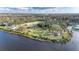 Aerial view showcasing community park with river access, picnic areas, and playground at 8204 Stoner Rd, Riverview, FL 33569