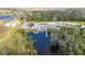 Aerial view shows public boat ramp and dock with ample parking and river access at 8204 Stoner Rd, Riverview, FL 33569