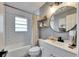 Cozy bathroom features subway tile surround, tub and shower, and vanity at 8204 Stoner Rd, Riverview, FL 33569