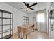 Office space with wood desk, shelving, and natural light from window at 8204 Stoner Rd, Riverview, FL 33569