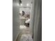 Modern bathroom design featuring stone-style tile, a round mirror, sleek vanity, and an inviting atmosphere for relaxation at 8706 N Boulevard, Tampa, FL 33604