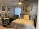 Bright bedroom featuring a comfortable bed with elegant furnishings and decor, plus a ceiling fan for added comfort at 8706 N Boulevard, Tampa, FL 33604