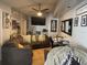 Cozy living area with a plush sectional sofa, a workspace, and personal touches at 8706 N Boulevard, Tampa, FL 33604