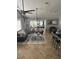 Comfortable living room featuring stylish decor, plush seating, and a dining view at 8706 N Boulevard, Tampa, FL 33604