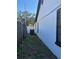 Shows a clean exterior with white paint, black trim, and an air conditioning unit at 8706 N Boulevard, Tampa, FL 33604