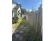 Stone pavers in the side yard, with a wooden fence along the perimeter at 8706 N Boulevard, Tampa, FL 33604