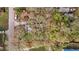 Aerial view showcasing the property's boundaries surrounded by lush greenery at 9435 Ottawa St, New Port Richey, FL 34654