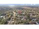 Aerial view of a neighborhood surrounded by lush trees, with cozy homes at 9435 Ottawa St, New Port Richey, FL 34654