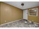 A simple bedroom featuring durable floors and a window for natural light at 9435 Ottawa St, New Port Richey, FL 34654