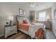 Cozy bedroom features warm colors, a comfortable bed, and well-lit natural lighting at 1002 Vineyard Ln, Oldsmar, FL 34677