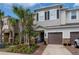 Charming two-story home with a one car garage, manicured landscaping, and lovely curb appeal at 1002 Vineyard Ln, Oldsmar, FL 34677