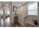 Bright hallway with wood floors and modern decor leads to the main living area at 1002 Vineyard Ln, Oldsmar, FL 34677