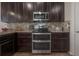 Close-up of the well-equipped kitchen, showcasing stainless steel appliances, and ample cabinet space at 1002 Vineyard Ln, Oldsmar, FL 34677