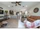 Open-concept living and dining area with tiled floors and plenty of natural light at 1002 Vineyard Ln, Oldsmar, FL 34677