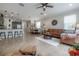 View of the living room, dining room, and kitchen area in an open-concept home at 1002 Vineyard Ln, Oldsmar, FL 34677