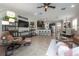 Spacious living room with an open-concept layout connecting to the dining room and kitchen at 1002 Vineyard Ln, Oldsmar, FL 34677