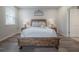 Inviting main bedroom with wooden bed frame, soft rug, and elegant decor at 1002 Vineyard Ln, Oldsmar, FL 34677