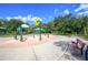 Colorful community splash pad with playful water features and shaded seating areas, perfect for Gathering fun on sunny days at 1002 Vineyard Ln, Oldsmar, FL 34677