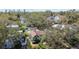 Aerial view showcasing property with lush landscaping and tree coverage with cityscape in distance at 114 27Th N Ave, St Petersburg, FL 33704