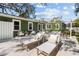 Inviting backyard featuring an outdoor seating area and lounge chairs on a stone patio at 114 27Th N Ave, St Petersburg, FL 33704