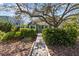 Inviting home exterior with a concrete walkway and manicured shrubs at 114 27Th N Ave, St Petersburg, FL 33704