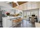 Bright kitchen with island and bar seating featuring unique tile floors and a stylish wood ceiling at 114 27Th N Ave, St Petersburg, FL 33704