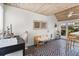 Home office area featuring unique tile floors, a stylish wood ceiling, and natural light at 114 27Th N Ave, St Petersburg, FL 33704