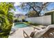 Relax by this sparkling pool, surrounded by greenery and lounge chairs at 114 27Th N Ave, St Petersburg, FL 33704