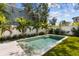 This sparkling pool is surrounded by lush greenery and a white fence at 114 27Th N Ave, St Petersburg, FL 33704