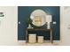 Modern entryway with stylish table, decorative mirror, and tasteful decor at 11862 Sparkling Topaz Cv, Parrish, FL 34219